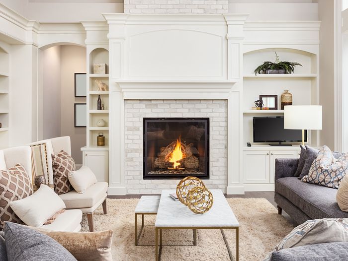 A fireplace mantel that is ready to be decorated.