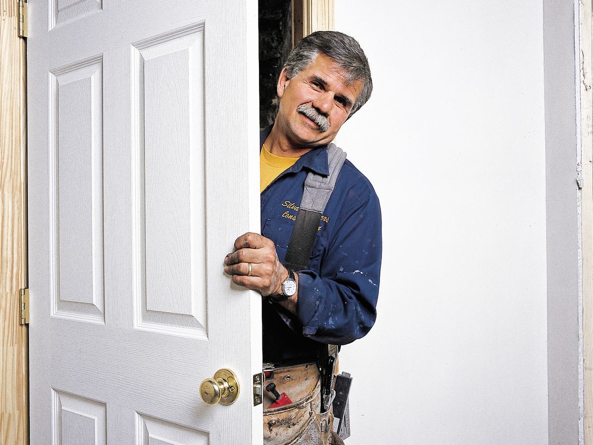 Photo of Tom Silva during the installation process for a prehung door